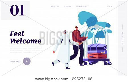Hotel Bellboy Meet Arabic Guest In Hall Transporting Baggage By Cart. Muslim Businessman Stay In Gue