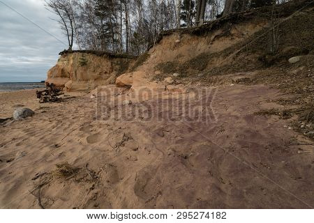 Limestone Beach At The Baltic Sea With Beautiful Sand Pattern And Vivid Red And Orange Color - Touri