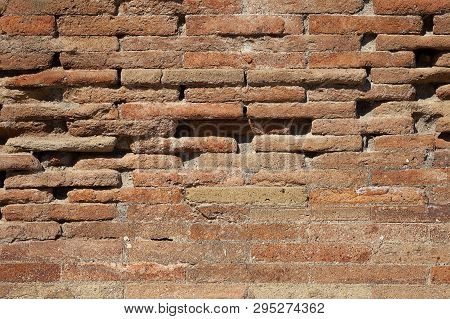 Old Red Brick Wall Texture Background With Scratches, Cracks, Dust, Crevices, Roughness. 
Grungy Wid
