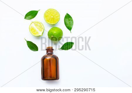 Ripe Limes With Essetial Oil On White Background.