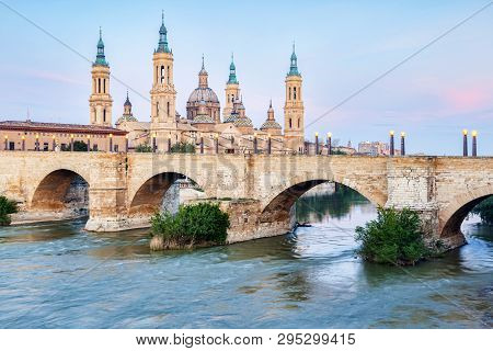 Basilica Of Our Lady Of The Pillar, Puenta De Piedra  And The River Ebro, Zaragoza, Aragon, Spain.