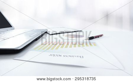 Calculator And A Marketing Scheme On The Table From A Businessm