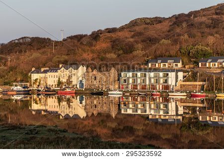 Pier And Buildings Reflected In Clifden Bay