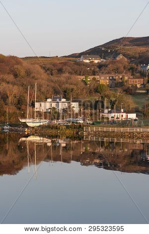 Pier And Buildings Reflected In Clifden Bay