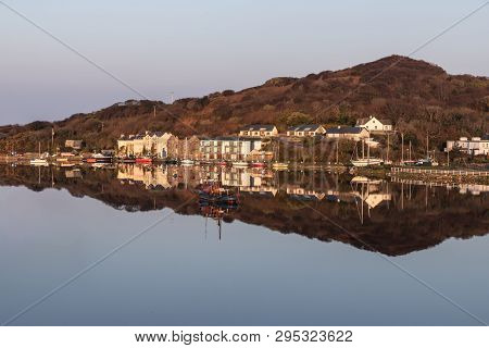 Pier And Buildings Reflected In Clifden Bay