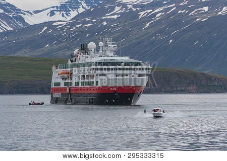 Hrisey, Iceland - June 8. 2018: Cruise Ship Fram From Norwegian Shipping Company Hurtigruten In Eyja