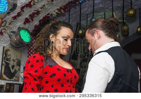 Granada, Spain - April 26, 2014: Couple Dancing Flamenco During A Flamenco Show In A Typical Sacromo
