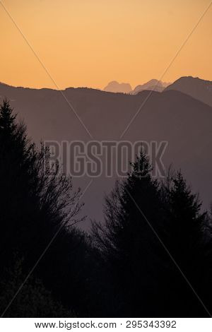 Sunset View From Border Road Of Slovenia And Italy To Mountains Mangart And Kanin In Julian Alps