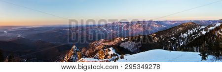 Winter Panorama From Cozia Peak On Olt River And Builla Vnaturarita Mountains