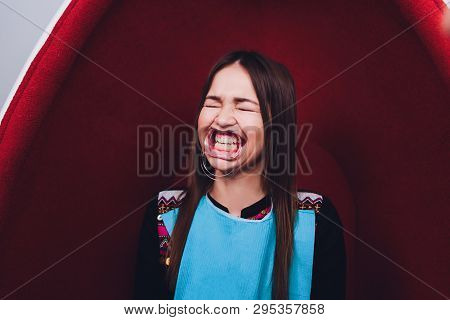Close Up Of Female Mouth With Retractor. Doctor Flossing The Teeth. Dental Gag.