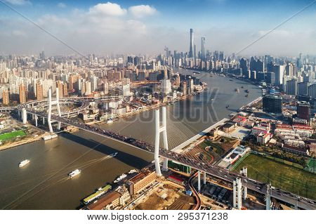 Shanghai Nanpu Bridge over Huangpu River with busy traffic in China.