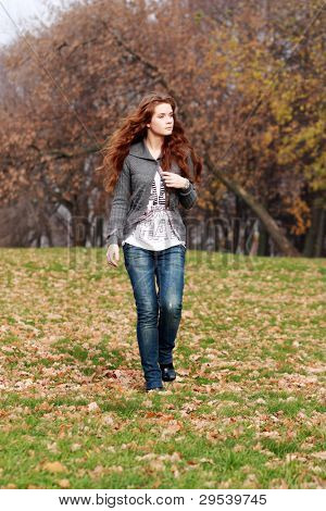 Young woman in autumn park