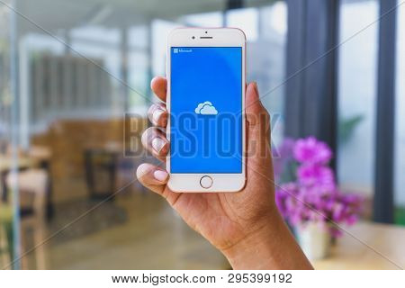 Chiang Mai, Thailand - Mar 02,2018: Woman Holding Apple Iphone 6s Rose Gold With Onedrive On Screen.