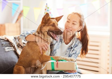 Portrait Of Asian Woman Giving Present To Gog On Birthday, Copy Space