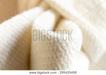 Close-up Of The White Ribbon Of Thick Material.coat Or Jacket.aterial.coat Or Jacket.