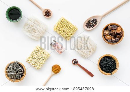 Chinese And Japanese Food Cooking With Mushrooms, Spices And Noodles On White Background Top View Ge