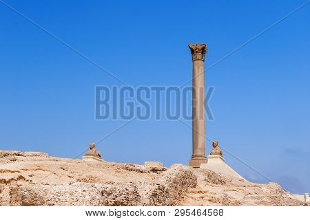 Pompeys Pillar, Roman Triumphal Column, With Two Sphinx Statues Located At The Serapeum Of Alexandri