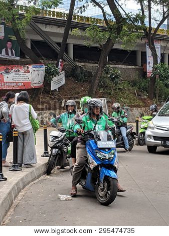 Jakarta, Indonesia - April 7, 2019: Some Drivers Of Ojek Online (taxi Motorbike) Waiting For Passeng