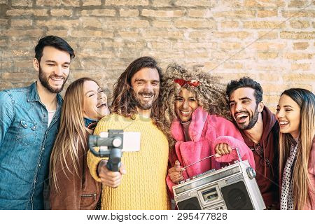 Group Of Friends Making Video With Gimbal Mobile Smartphone Outdoor - Millennial Young People Having