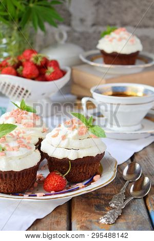 Chocolate Cupcake With Vanilla Cream And Strawberries. Vintage Style