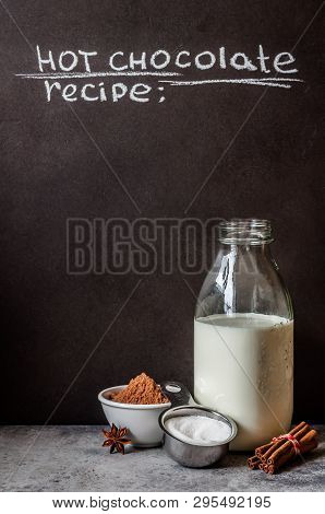Hot Chocolate Ingredients Near A Blackboard To Whrite The Recipe On, Copy Space For Your Text