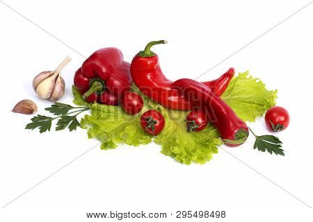 Red Sweet Pepper And Tomato On A White Background. Red Sweet Long Pepper And Tomato On A White Backg