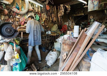 Bangkok, Thailand - March 2019: Carpenter Working In His Teak Wook Workshop In Golden Mount Region.