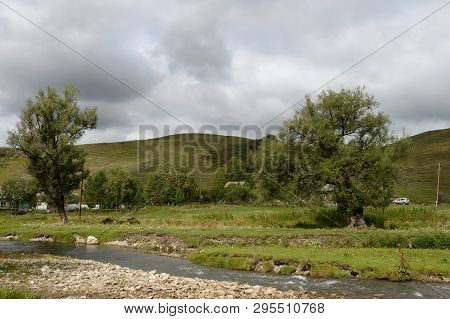 The Mountain River Yarovka In The Village Of Generalka Of The Altai Territory. Western Siberia. Russ