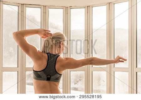 Beautiful Blonde Female Trainer Showing Her Arm And Back Muscels. Healthy, Active Lifestyle, Losing 