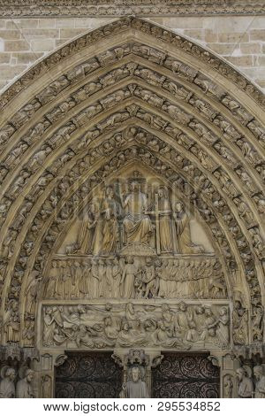Exhaulted Horizontal View Of Interior Of Notre Dame Of Paris, France In Golden Lights On Ancient Sto