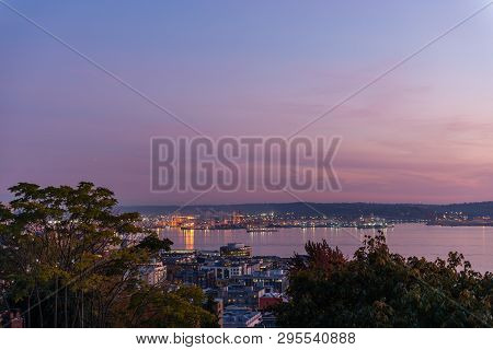 The Sky Takes On A Purple Tone At Dusk In The Port Of Seattle And Elliott Bay, Washington, Usa.