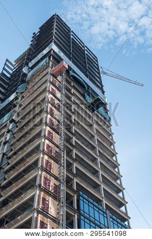 Bottom View Of An Under Construction Skyscraper In Seattle On A Clear Day, Washington, Usa.