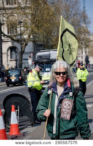 London, United Kingdom, 15th April 2019:- Extinction Rebellion Protesters Block And March Down White
