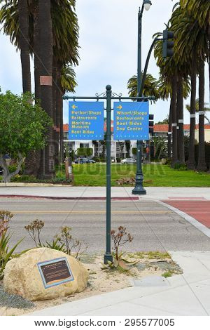SANTA BARBARA, CALIFORNIA - APRIL 11, 2019: Directions along Cabrillo Boulevard at the Syuxtun Story Circle Marker with Ambassador Park in the background.