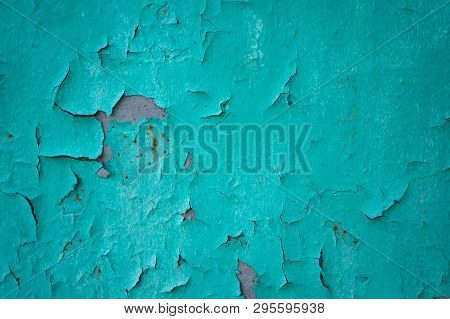 Old Turquoise Wall With Cracks And The Exfoliated Paint