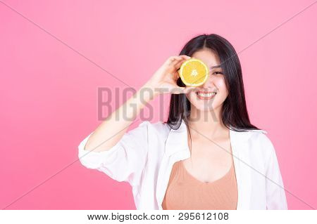 Beauty Woman Asian Cute Girl Feel Happy Holdind Orange Fruit For Good Health  On Pink Background - L
