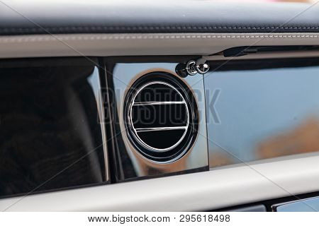 A Close-up View Of A Part Of The Interior Of A Modern Luxury Car With A View Of The Ventilation Defl