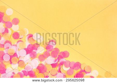 Orange, Pink And White Confetti On Orange Background.  Flat Lay Style. Top View. Copyspace For Text.
