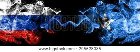 Russian Vs Somalia, Somalian Smoke Flags Placed Side By Side. Thick Colored Silky Smoke Flags Of Rus