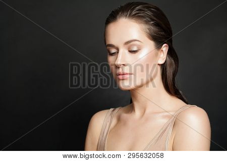 Healthy Womal With Clear Skin On Black Background. Skincare And Facial Treatment