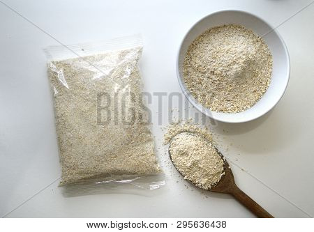 Oats Packaging Transparent Bag Of Cereal Oat Flakes. Bowl Of Oats. Wooden Spoon With Oat Flakes.
