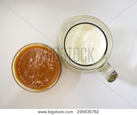 Sweet Milk Viewed From Above Isolated On White Background. Sweet Bowl Of Milk.