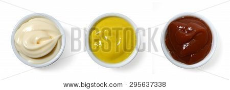 Sauces. Mayonnaise, Catchup And Mustard In Small Porcelain Containers Viewed From Above.