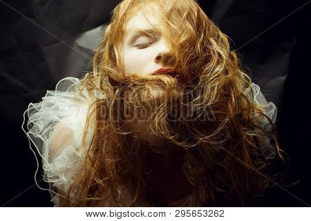 Retro Portrait Of Red-haired (ginger) Queen Like Girl Over Wrinkled Black Paper Background. Studio S