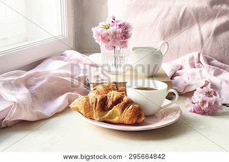 Spring Still Life Scene. Cup Of Coffee, Croissant Pastry, Old Books And Milk Pitcher. Vintage Femini