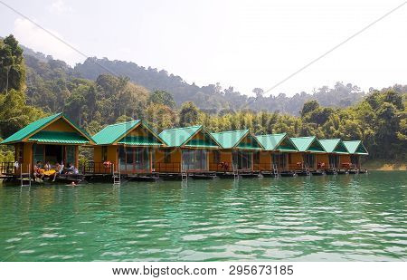 Lake Cheo Lan, Thailand, February 18, 2018: Houses On The Water Against The Backdrop Of A Picturesqu