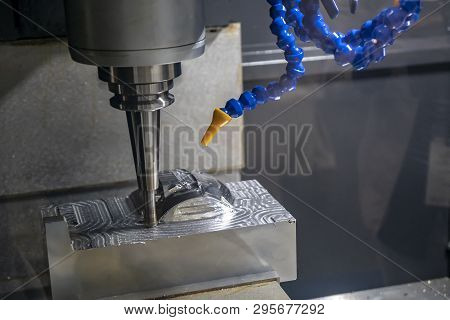 The  Cnc Milling Machine Cutting The Mould Part With The Solid Ball End Mill Tool.the Hi-technology 