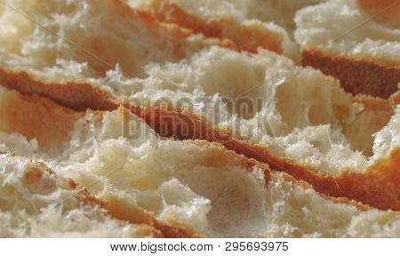 Close up fresh crispy baguette. Sliced frensh bread. Healthy concept.