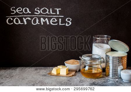 Sea Salt Caramel Candy Ingredients Near A Blackboard To Whrite The Recipe On, Copy Space For Your Te