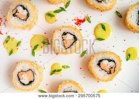 Sushi Rolls Scattered On White Background Close Up